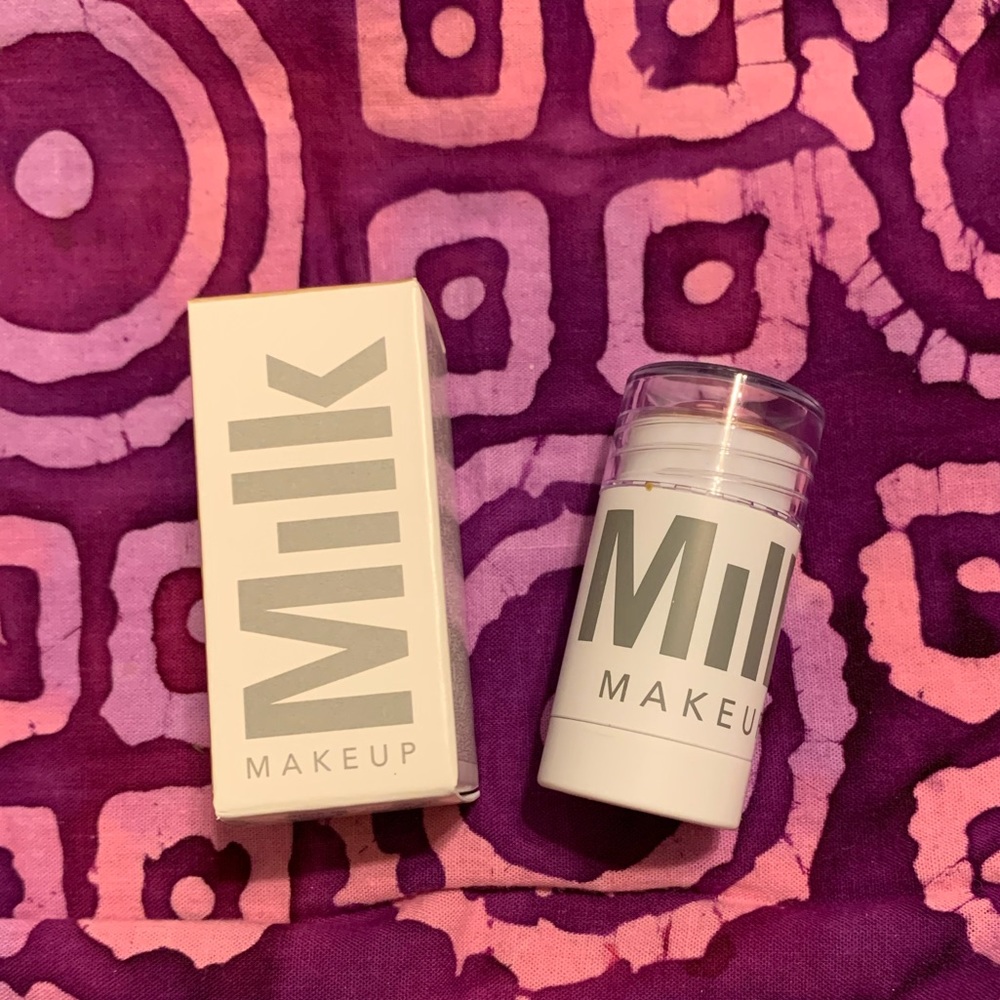 Milk Creamy Pearlescent highlighter stick in lit